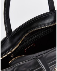 Borsa shopping in pelle con borchie nera e dorata di DKNY