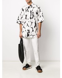 Camicia a maniche corte a fiori bianca e nera di Givenchy