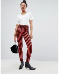 Jeans aderenti a righe verticali rossi