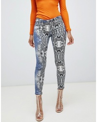 Jeans aderenti con stampa serpente multicolori di ASOS DESIGN