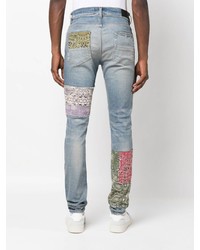 Jeans aderenti patchwork azzurri di Amiri