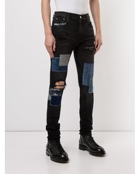 Jeans aderenti patchwork neri di Amiri