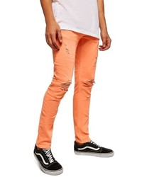 Jeans aderenti strappati arancioni