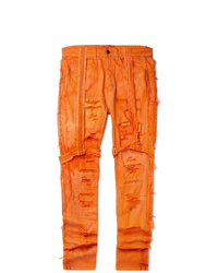 Jeans aderenti strappati arancioni di EV BRAVADO