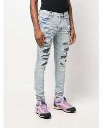 Jeans aderenti strappati azzurri di purple brand