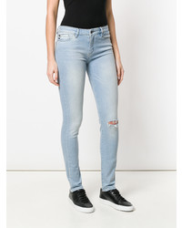 Jeans aderenti strappati azzurri di Love Moschino