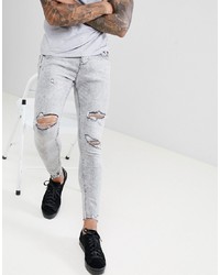 Jeans aderenti strappati grigi di Bershka