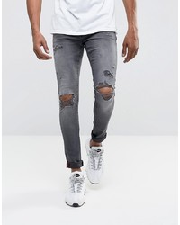 Jeans aderenti strappati grigi di DML