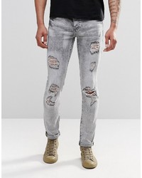 Jeans aderenti strappati grigi