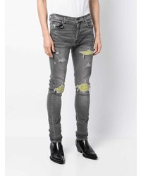 Jeans aderenti strappati grigi di Amiri