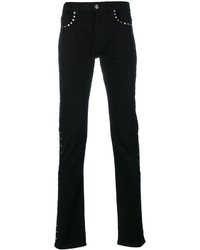 Jeans con borchie neri di Versace