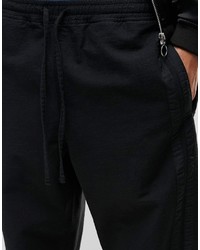 Pantaloni sportivi a righe orizzontali neri di Asos