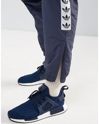 Pantaloni sportivi blu scuro di adidas