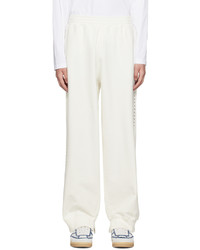Pantaloni sportivi con borchie bianchi di MM6 MAISON MARGIELA
