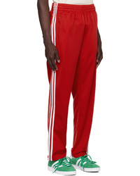 Pantaloni sportivi rossi di adidas Originals