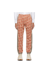 Pantaloni sportivi stampati arancioni di Gucci
