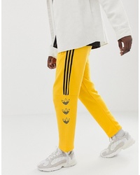 Pantaloni sportivi stampati gialli di adidas Originals