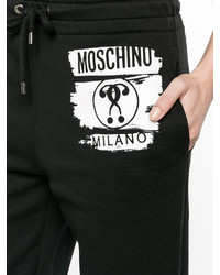 Pantaloni stampati neri di Moschino