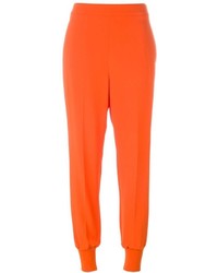 Pantaloni stretti in fondo arancioni