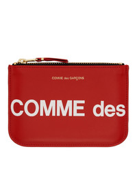 Pochette in pelle stampata rossa di Comme des Garcons Wallets