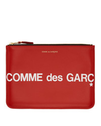 Pochette in pelle stampata rossa di Comme des Garcons Wallets