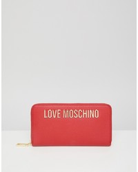 Pochette in pelle stampata rossa di Love Moschino