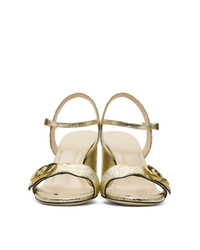 Sandali con tacco in pelle dorati di Gucci
