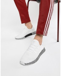 Scarpe sportive bianche e nere di adidas Originals