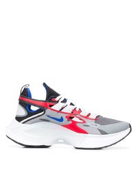 Scarpe sportive bianche e rosse e blu scuro di Nike