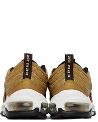 Scarpe sportive in pelle dorate di Nike