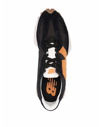 Scarpe sportive nere e arancione di New Balance