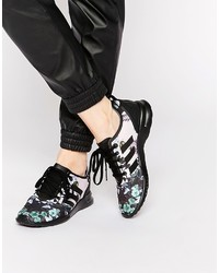 Sneakers alte a fiori nere di adidas