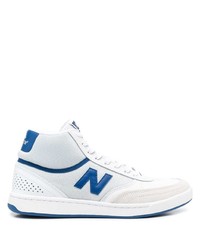 Sneakers alte di tela bianche e blu di New Balance