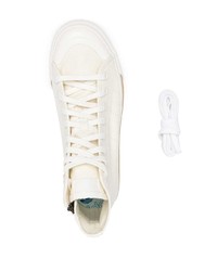 Sneakers alte di tela bianche di adidas