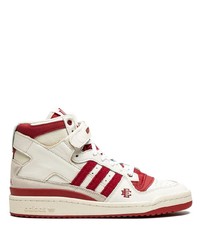 Sneakers alte in pelle bianche e rosse di adidas