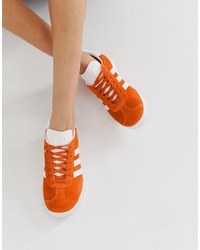 Sneakers basse arancioni di adidas Originals