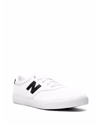 Sneakers basse di tela bianche e nere di New Balance