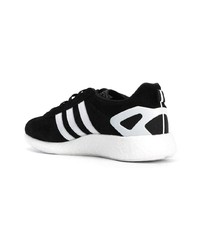 Sneakers basse di tela nere e bianche di adidas