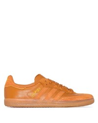 Sneakers basse in pelle arancioni di adidas