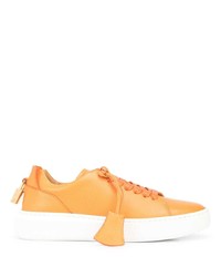 Sneakers basse in pelle arancioni di Buscemi