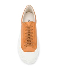 Sneakers basse in pelle arancioni di Jil Sander