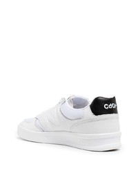 Sneakers basse in pelle bianche e nere di Comme des Garcons Homme