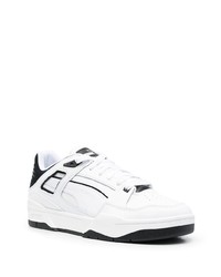 Sneakers basse in pelle bianche e nere di Puma