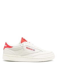 Sneakers basse in pelle bianche e rosse di Reebok