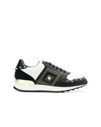 Sneakers basse in pelle con borchie nere e bianche di Versace Collection