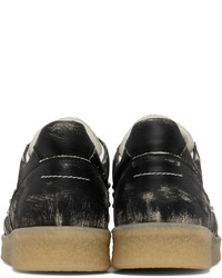 Sneakers basse in pelle con borchie nere di MM6 MAISON MARGIELA