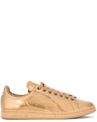 Sneakers basse in pelle dorate di Adidas By Raf Simons