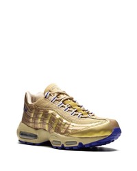Sneakers basse in pelle dorate di Nike
