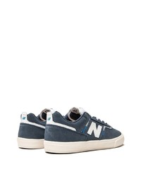 Sneakers basse in pelle scamosciata blu scuro e bianche di New Balance
