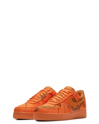 Sneakers basse mimetiche arancioni